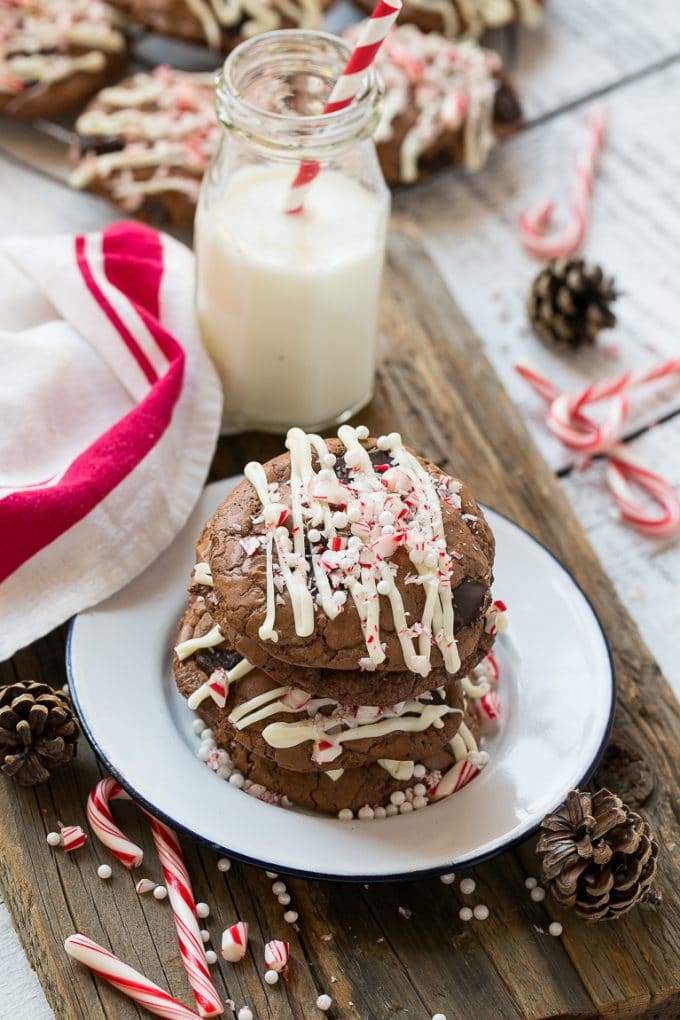 Peppermint Bark Cookie | Easy Peppermint Bark Cookies | Christmas Cookies | Peppermint Bark Cookies | Chocolate Peppermint Cookie #peppermint #peppermintbark #cookies #christmas #holiday #dessert #uzhal A plate of chocolate peppermint bark cookies with a bottle of milk on the side.