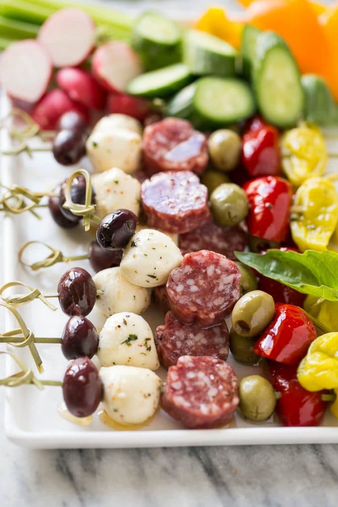 Antipasto Skewers Recipe | Easy Antipasto | Best Antipasto #antipasto #skewers #appetizer #uzhal Antipasto skewers on a white serving platter.