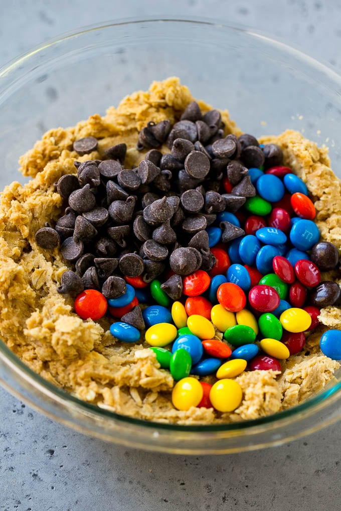Cookie dough with chocolate chips and M&M's on top.