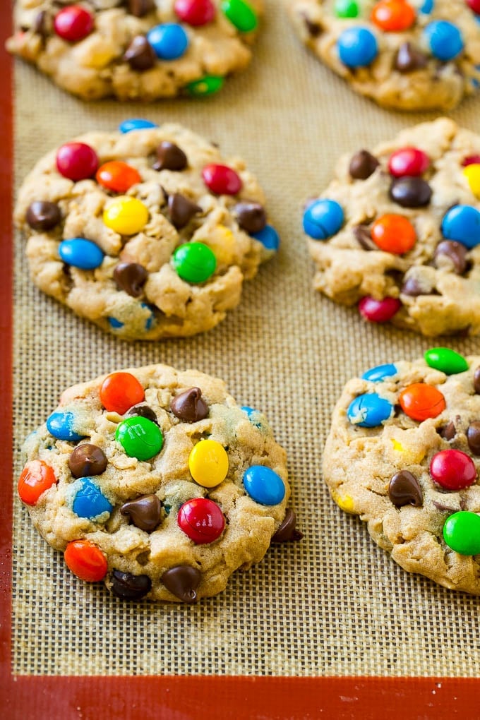 Baked monster cookies on a sheet pan.