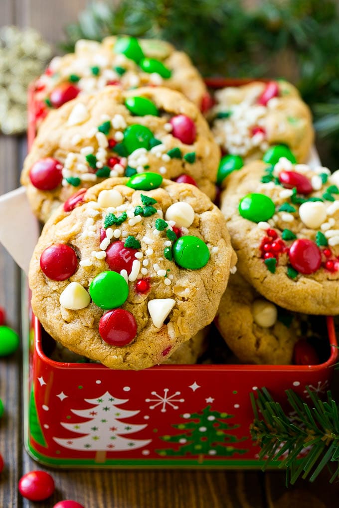 Christmas Monster Cookies Recipe | Oatmeal Cookies | Peanut Butter Cookies | M&M's Cookies #baking #cookies #dessert #peanutbutter #chocolate #uzhal #christmas #sprinkles Christmas monster cookies in a gift tin.