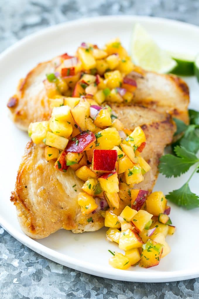 Peach Salsa | Fruit Salsa #peaches #salsa #dip #appetizer #uzhal Peach salsa served over grilled chicken breast.