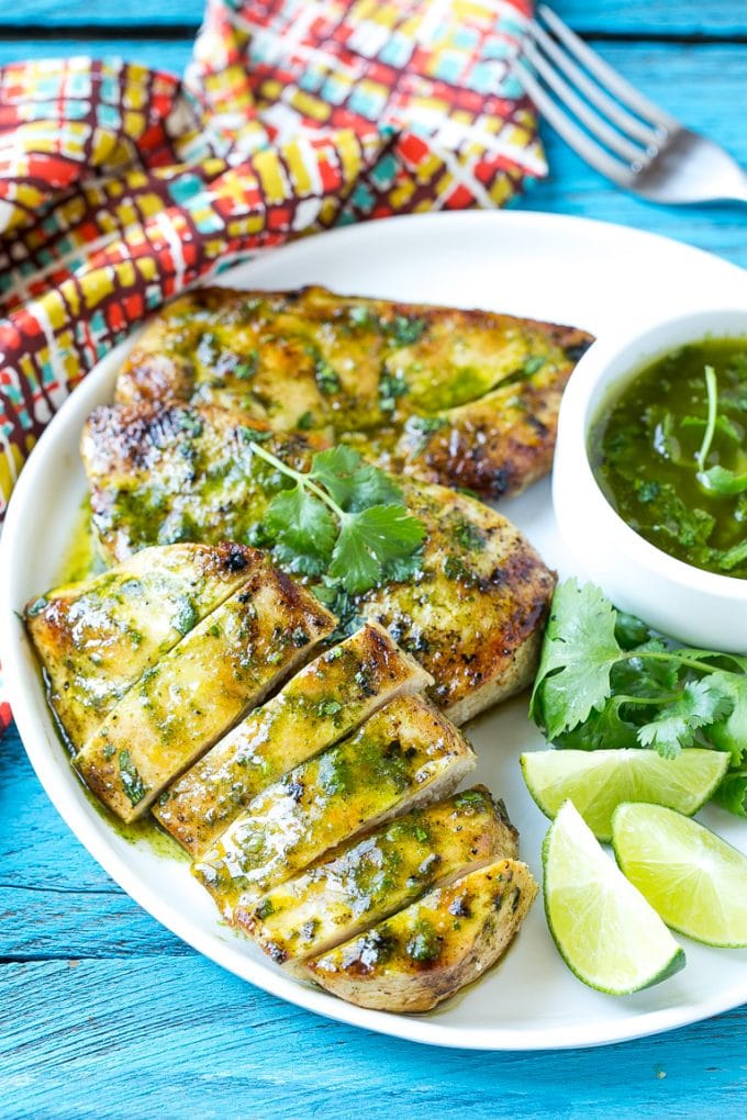 Cilantro Lime Chicken | Grilled Chicken #chicken #grilling #cilantro #lime #dinner #uzhal Sliced cilantro lime chicken on a serving plate.