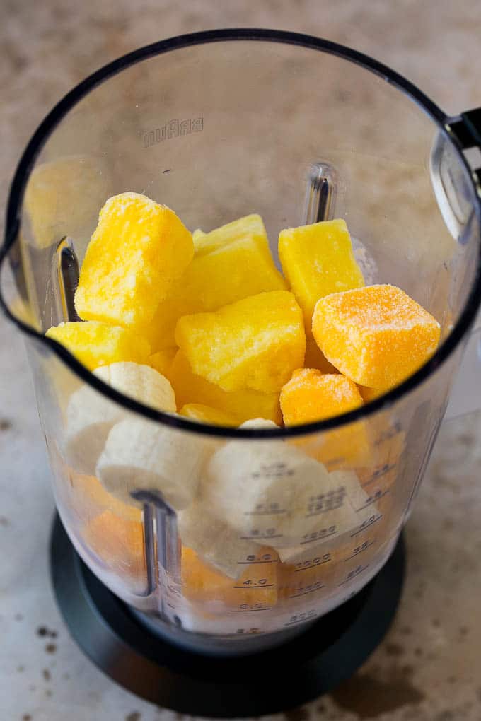 Tropical Smoothie Recipe | Mango Smoothie | Pineapple Smoothie #smoothie #mango #pineapple #banana #drink #uzhal Pineapple, mango, banana and coconut milk in a blender.
