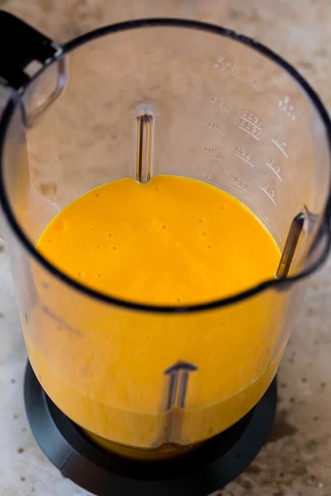 Tropical Smoothie Recipe | Mango Smoothie | Pineapple Smoothie #smoothie #mango #pineapple #banana #drink #uzhal A smoothie inside of a blender.