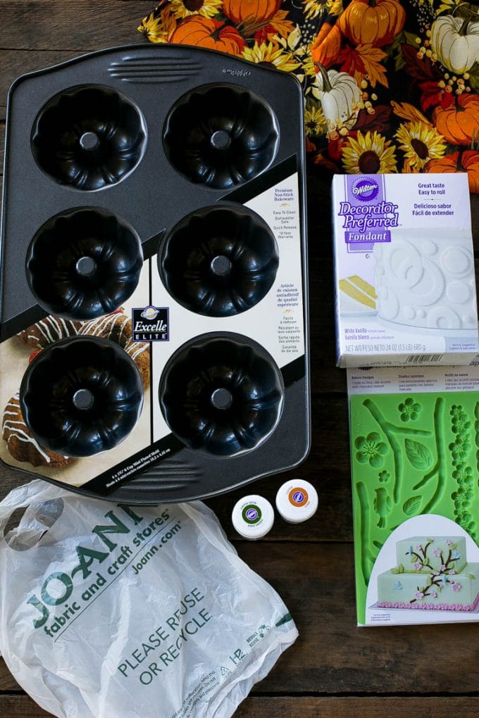 Pumpkin Spice Cake Recipe | Pumpkin Cake | Easy Pumpkin Cake | Thanksgiving Dessert #thanksgiving #pumpkin #cake #pumpkincake #spicecake #dessert #uzhal #holiday Cake making tools including fondant, a cake pan, tubs of gel food color and fondant molds.