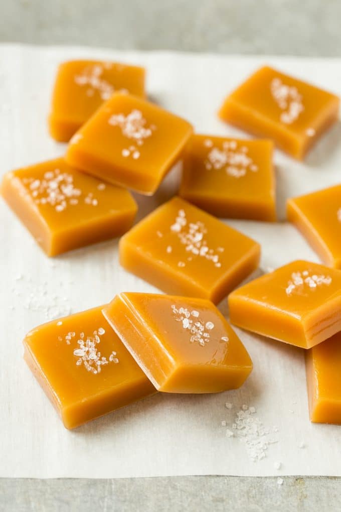 Microwave Caramels with Sea Salt Recipe | Homemade Caramels | Sea Salt Caramel | Homemade Candy #candy #caramels #caramel #microwavecaramels #homemade #dessert #uzhal Squares of caramel topped with coarse salt.