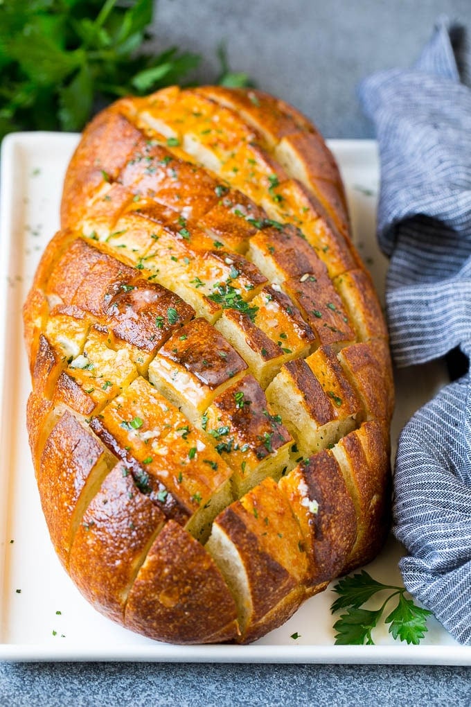 Pull Apart Bread | Garlic Bread | Cheese Bread #bread #garlic #cheese #sidedish #appetizer #uzhal Baked garlic pull apart bread garnished with parsley.