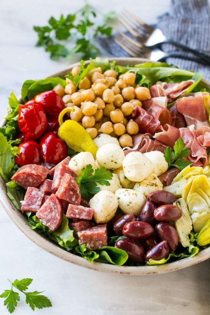 Antipasto Salad Recipe | Italian Salad | Main Course Salad | Antipasto Recipe #salad #salami #italianfood #dinner #lunch #uzhal Antipasto salad with cured meats, fresh mozzarella cheese and roasted peppers over salad greens.