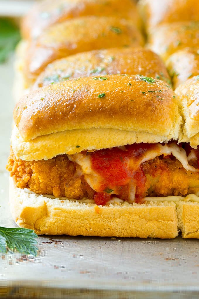 Chicken Parmesan Sliders | Chicken Parmesan Sandwich Recipe | Slider Sandwich Recipe #sliders #chickenparm #chickenparmesan #chickenparmesansliders #dinner #appetizer #uzhal Crispy chicken with tomato sauce and cheese on slider buns.