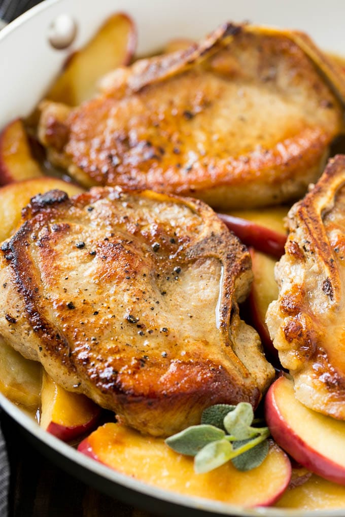 Apple Pork Chops Recipe | Pork Chops with Apples | Cider Pork Chops | Bone In Pork Chops Recipe #pork #porkchops #fall #apple #dinner #uzhal Seared pork in a pan in a sweet and savory sauce with fresh herbs.