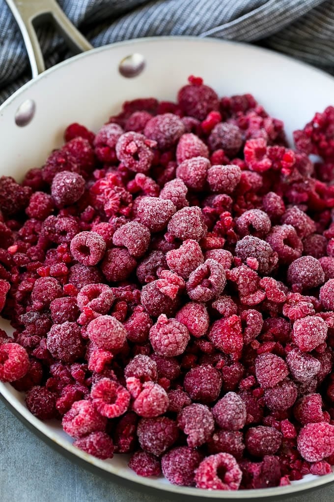 Raspberry Sauce Recipe | Homemade Raspberry Sauce | Raspberry Recipe #raspberries #dessert #uzhal A pan of frozen berries.