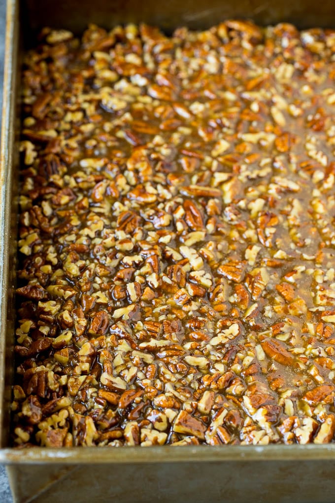 Pecan Pie Bars Recipe #pecans #pie #fall #pecanpie #dessert #thanksgiving #uzhal Pecans and brown sugar poured over a cookie crust.