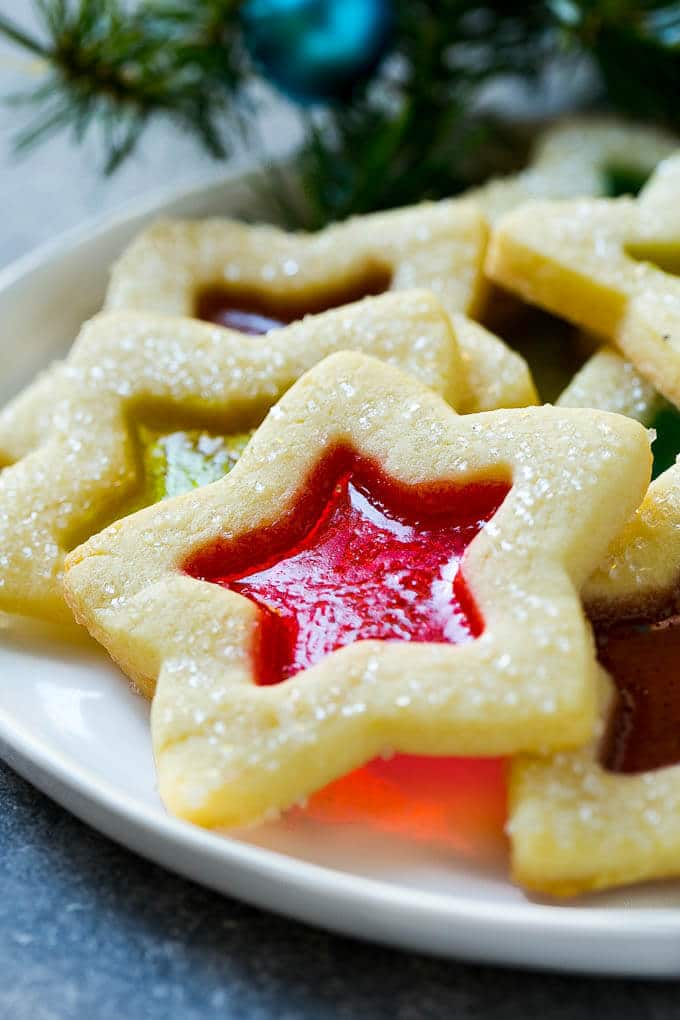Stained Glass Cookies | Stained Glass Window Cookies | Christmas Cookies | Sugar Cookies | Holiday Cookies #cookies #stainedglasscookies #sugarcookies #christmascookies #christmas #holiday #dessert #uzhal A star shaped cookie on a serving plate.