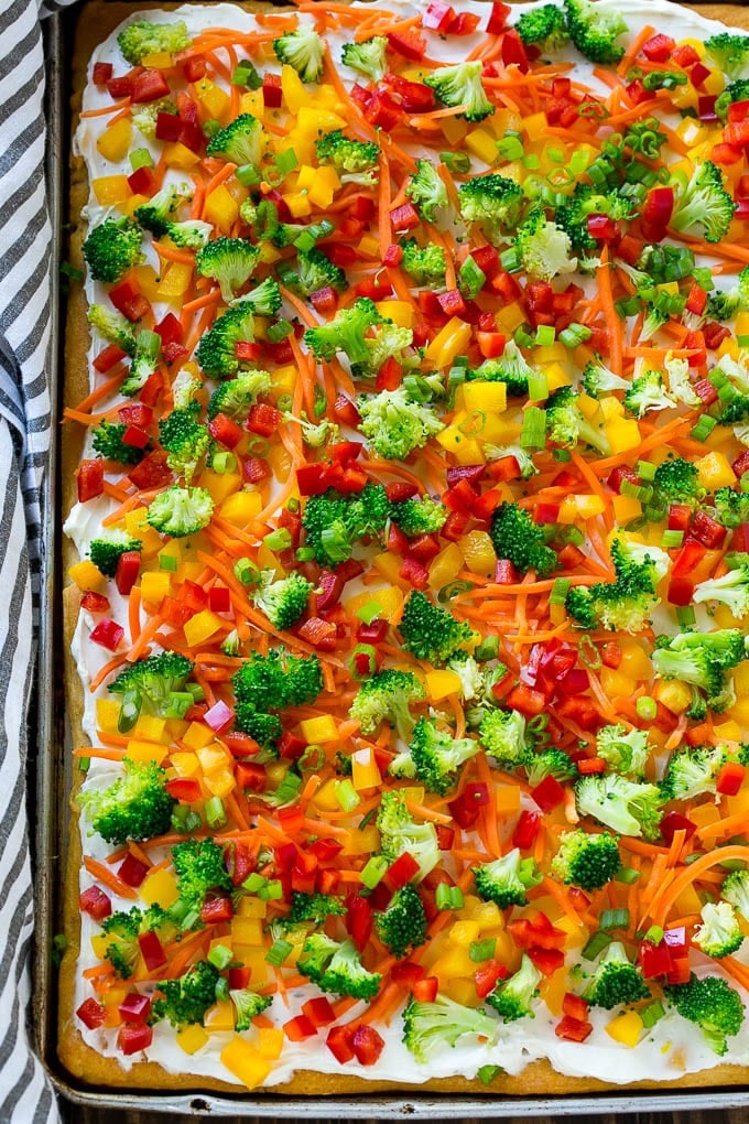 Veggie Pizza Recipe | Crescent Veggie Pizza | Vegetable Pizza Recipe | Holiday Appetizer | Homemade Veggie Pizza #pizza #veggies #vegetarian #appetizer #uzhal A sheet pan of crescent veggie pizza.