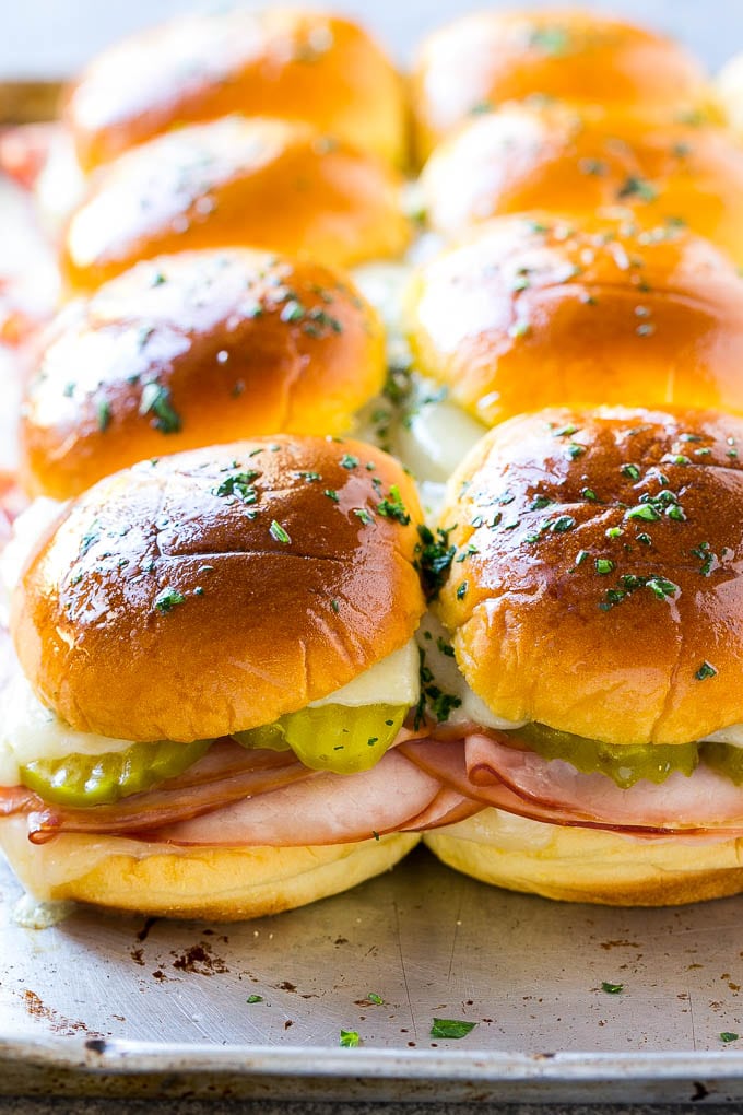Cuban Sliders Recipe | Cuban Sandwich Recipe | Slider Sandwiches | Ham and Cheese Sliders #sliders #sandwiches #ham #cheese #appetizer #uzhal A sheet pan of Cuban slider sandwiches.