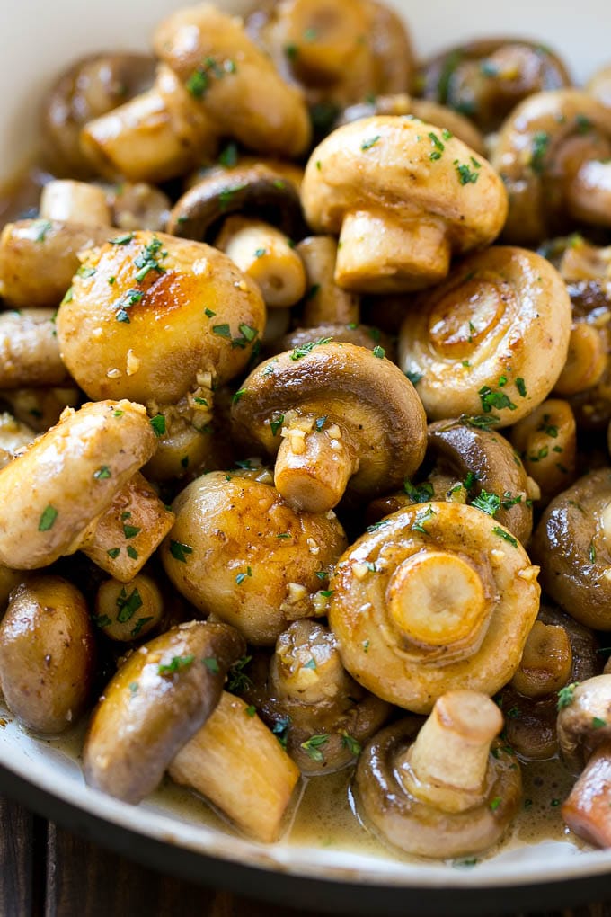 Garlic Mushrooms Recipe | Steakhouse Mushrooms | Sauteed Mushrooms | Garlic Butter Mushrooms | Mushroom Side Dish #mushrooms #butter #keto #lowcarb #dinner #sidedish #uzhal Garlic mushrooms in an herb and butter sauce in a frying pan.