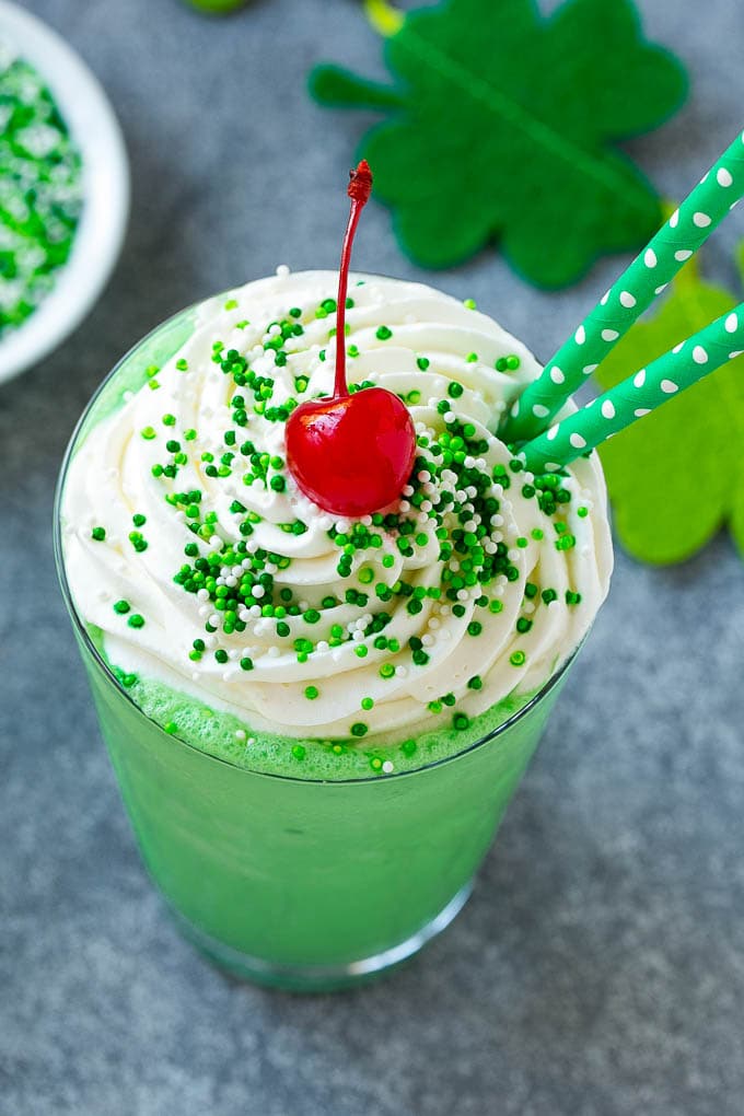Shamrock Shake Recipe | McDonald's Shamrock Shake | Saint Patrick's Day Drink | Mint Milkshake #milkshake #stpatricksday #saintpatricksday #mint #uzhal A mint Shamrock shake finished off with a swirl of whipped cream sprinkles and a cherry.