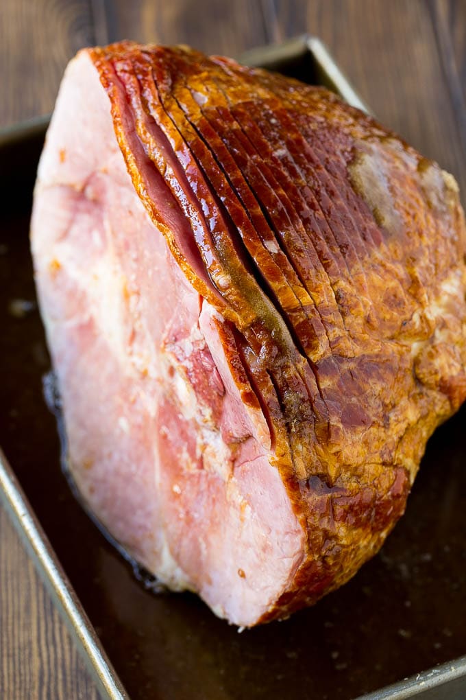 Coca Cola Ham | Coke Glazed Ham | Easter Ham | Christmas Ham | Holiday Ham Recipe #ham #easter #christmas #dinner #uzhal An uncooked spiral ham topped with coke and brown sugar.