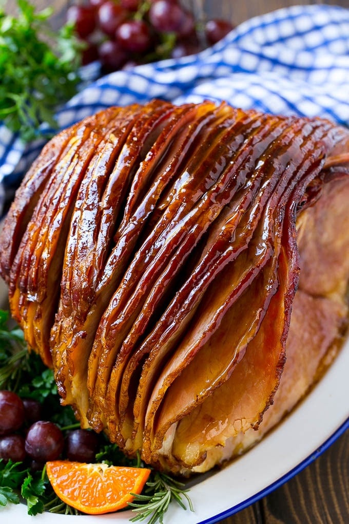 Coca Cola Ham | Coke Glazed Ham | Easter Ham | Christmas Ham | Holiday Ham Recipe #ham #easter #christmas #dinner #uzhal A whole spiral cut coca cola ham on a platter.