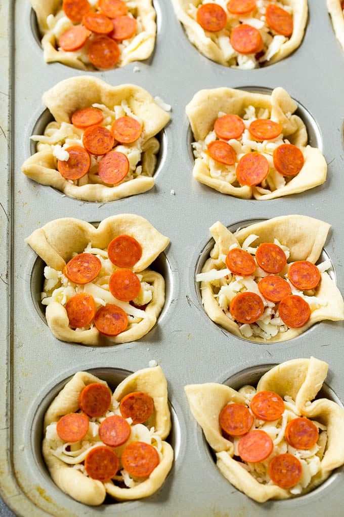 Pizza Muffins Recipe | Pizza Bites | Pizza Cups | Pizza Appetizer #pizza #appetizer #uzhal Unbaked dough cups filled with cheese, sauce and pepperoni.