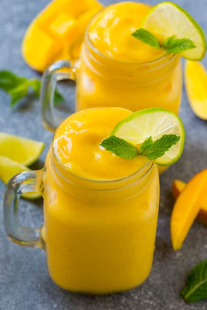 Mango Smoothie Recipe | Mango Recipe | Healthy Smoothie #mango #smoothie #drink #uzhal Mango smoothie in a mason jar mug.