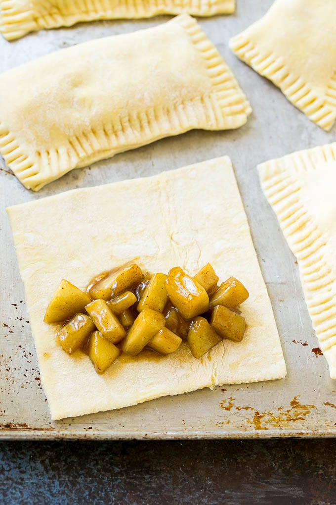 Fried Apple Pies Recipe | McDonald's Copycat Recipe | Apple Pie | Apple Hand Pies #pie #apples #applepie #dessert #snack #uzhal A sheet of puff pastry topped with homemade apple pie filling.