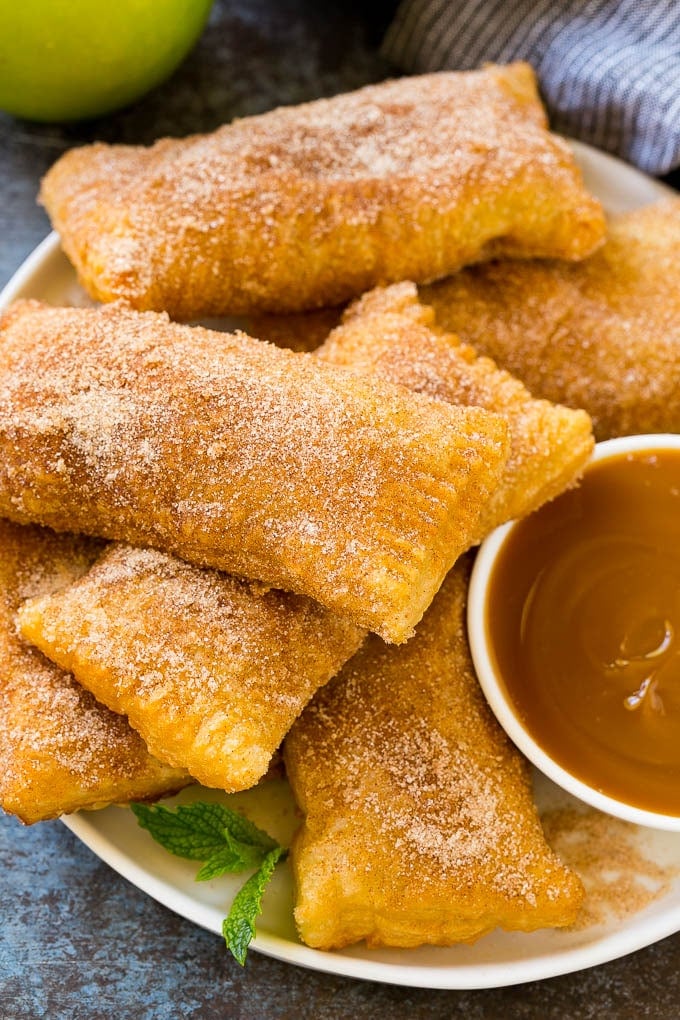 Fried Apple Pies Recipe | McDonald's Copycat Recipe | Apple Pie | Apple Hand Pies #pie #apples #applepie #dessert #snack #uzhal A plate of deep fried apple pies dusted with cinnamon sugar.