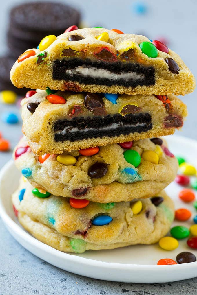 Oreo Stuffed Cookies Recipe | M&M's cookies | Stuffed Cookies #cookies #chocolate #oreos #dessert #baking #uzhal A stack of Oreo stuffed cookies on a plate.
