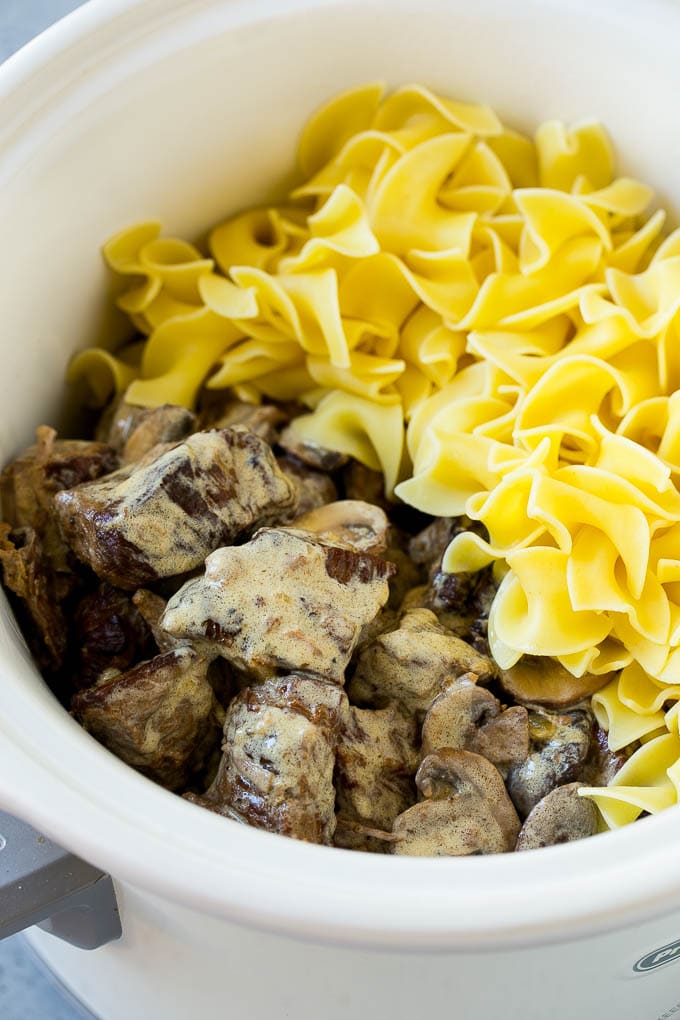 Slow Cooker Beef Stroganoff Recipe | Crock Pot Beef Stroganoff | Beef Recipe #slowcooker #crockpot #beef #mushrooms #pasta #dinner #uzhal Beef in a creamy sauce and egg noodles in a slow cooker.