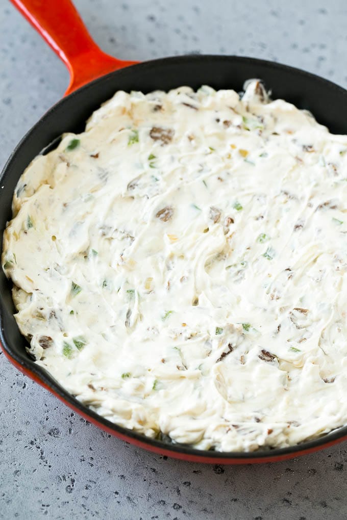 Philly Cheesesteak Dip Recipe | Cheesy Dip | Baked Cheese Dip #steak #dip #appetizer #cheese #uzhal Steak, peppers and onions in a skillet, mixed with cream cheese.