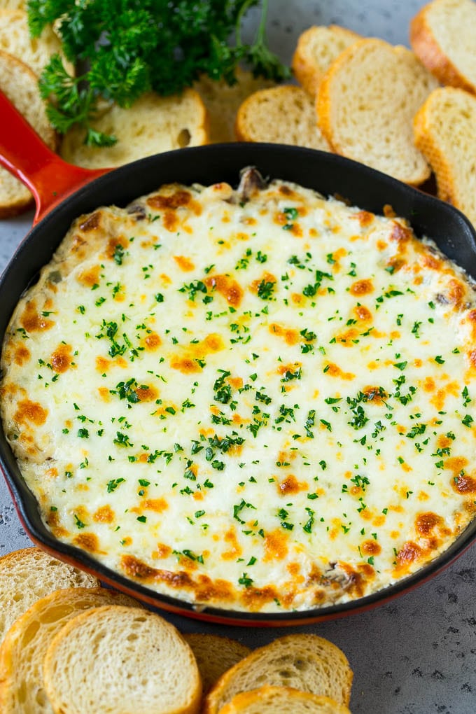 Philly Cheesesteak Dip Recipe | Cheesy Dip | Baked Cheese Dip #steak #dip #appetizer #cheese #uzhal A skillet of baked Philly cheesesteak dip with melted cheese and parsley on top.