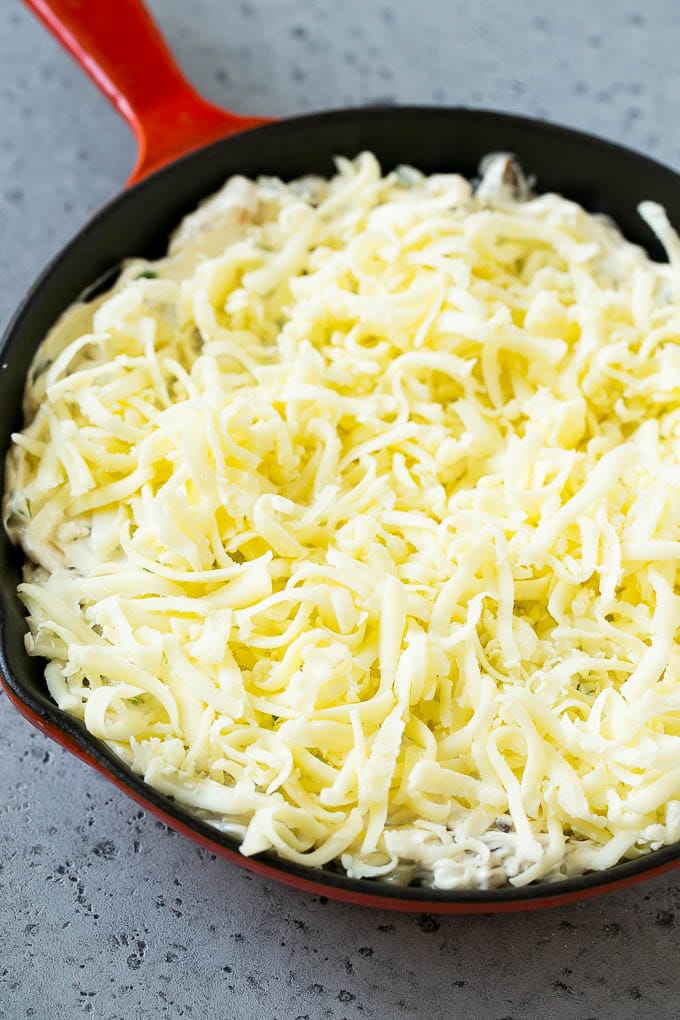 Philly Cheesesteak Dip Recipe | Cheesy Dip | Baked Cheese Dip #steak #dip #appetizer #cheese #uzhal Philly cheesesteak dip with shredded cheese on top, waiting to go into the oven.