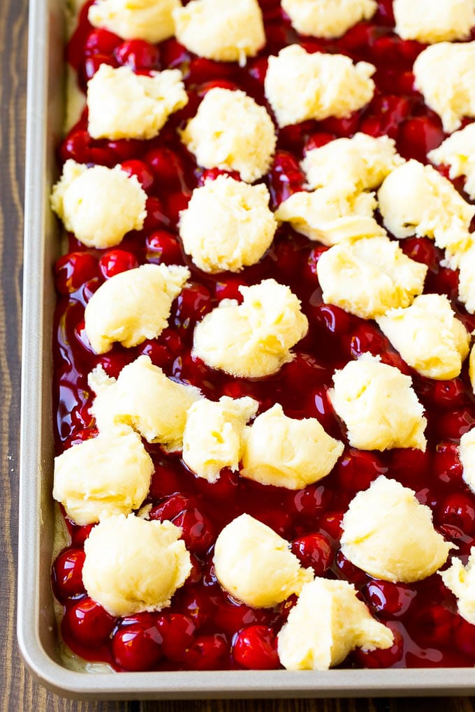 Cherry Bars Recipe | Cherry Pie Bars | Cherry Cookies | Bar Cookies #cookies #bars #cherry #baking #dessert #sweets #uzhal Filling with dollops of cookie dough on top.