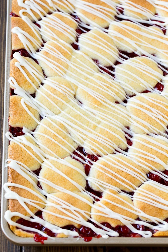 Cherry Bars Recipe | Cherry Pie Bars | Cherry Cookies | Bar Cookies #cookies #bars #cherry #baking #dessert #sweets #uzhal Cherry bars topped with vanilla glaze.