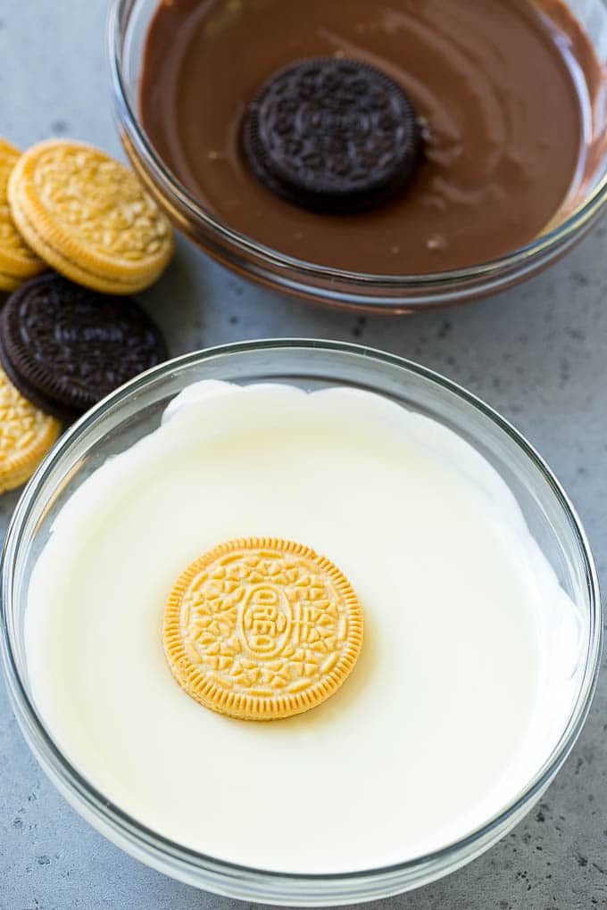 Chocolate Covered Oreos Recipe | Oreo Cookies | Chocolate Dipped Oreos #oreo #cookies #chocolate #sprinkles #dessert #uzhal Cookies being dipped into dark and white chocolate.