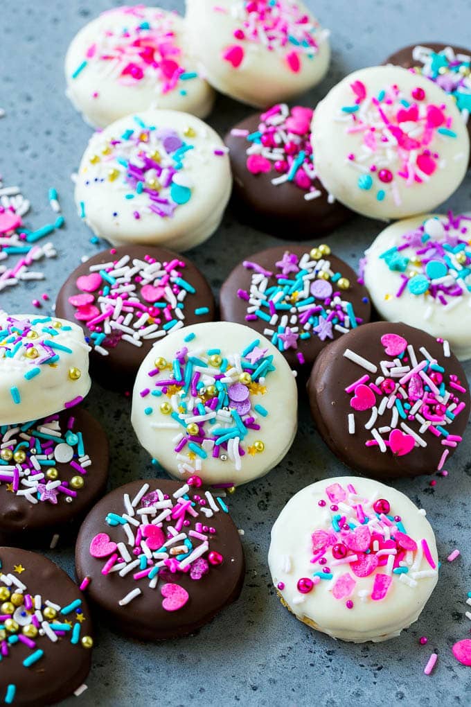 Chocolate Covered Oreos Recipe | Oreo Cookies | Chocolate Dipped Oreos #oreo #cookies #chocolate #sprinkles #dessert #uzhal Chocolate covered Oreos decorated with pink and purple sprinkles.