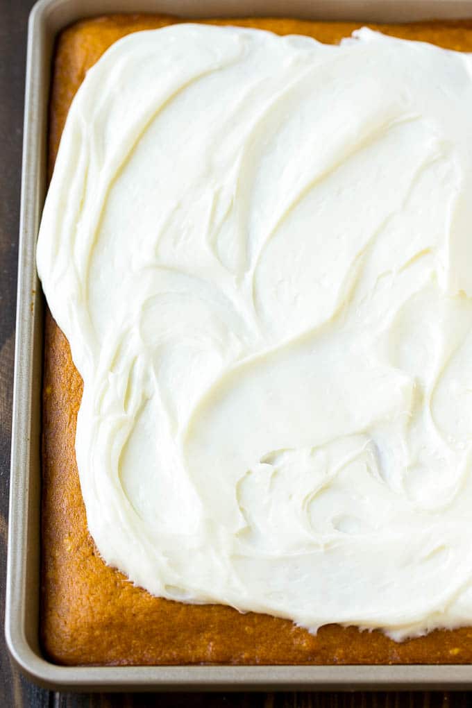 Pumpkin Bars Recipe | Pumpkin Cake | Pumpkin Dessert #pumpkin #fall #dessert #uzhal #thanksgiving Cream cheese frosting spread over cake.