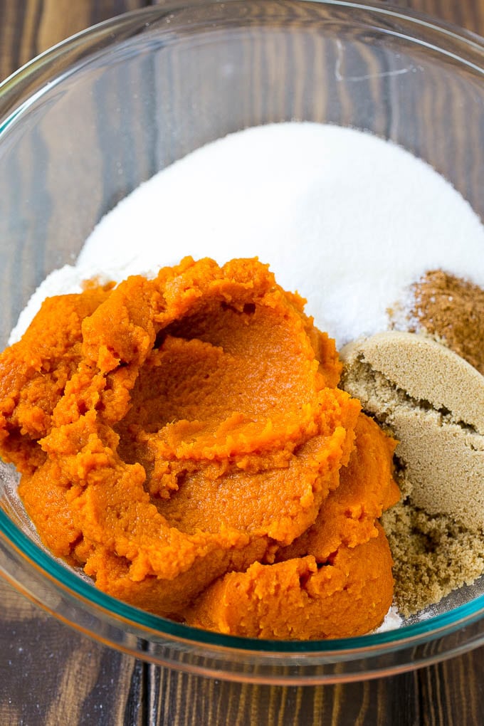 Pumpkin Bars Recipe | Pumpkin Cake | Pumpkin Dessert #pumpkin #fall #dessert #uzhal #thanksgiving Pumpkin puree, brown sugar and flour in a bowl.