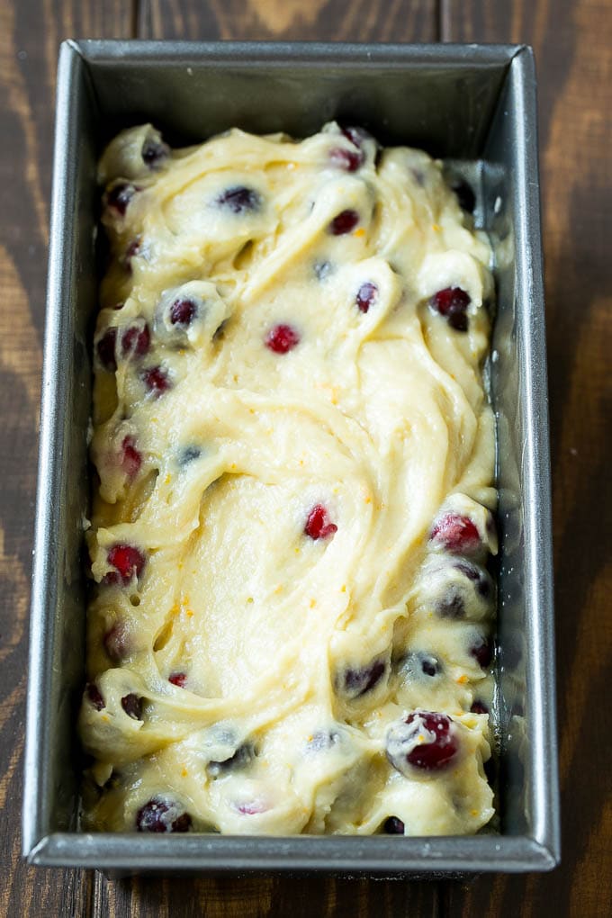 Cranberry Bread Recipe | Cranberry Loaf | Cranberry Orange Bread #cranberry #bread #baking #dessert #fall #uzhal Ccranberry bread batter spread into a loaf pan.