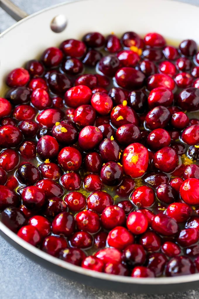 Cranberry Orange Sauce Recipe | Homemade Cranberry Sauce | Fresh Cranberry Sauce #cranberry #orange #fall #thanksgiving #sauce #dinner #uzhal Berries in a skillet with orange juice, sugar and orange zest.