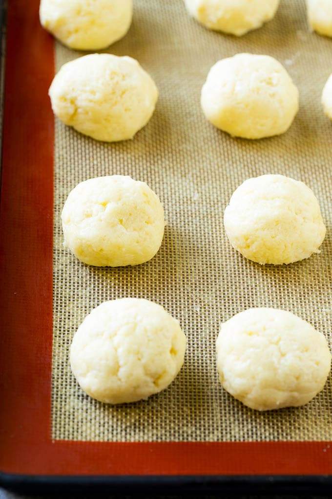 Gooey Butter Cookies Recipe | Cake Mix Cookies | Sprinkle Cookies | Christmas Cookies #cookies #butter #sprinkles #christmas #dessert #baking #uzhal Balls of dough on a baking sheet.