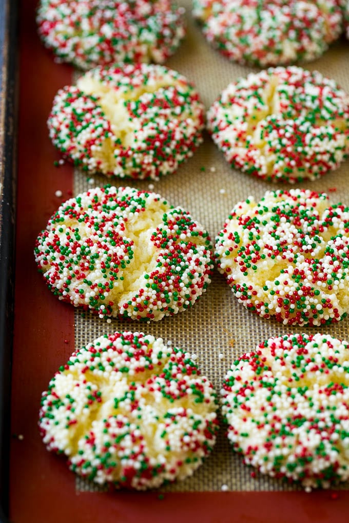 Gooey Butter Cookies Recipe | Cake Mix Cookies | Sprinkle Cookies | Christmas Cookies #cookies #butter #sprinkles #christmas #dessert #baking #uzhal Baked gooey butter cookies on a sheet pan.