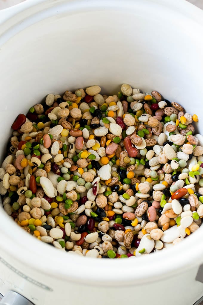 Ham and Bean Soup Recipe | Slow Cooker Ham and Bean Soup | Crockpot Ham and Bean Soup | Leftover Ham Recipe #ham #beans #soup #slowcooker #crockpot #dinner #uzhal A mixture of dried beans in a crock pot.