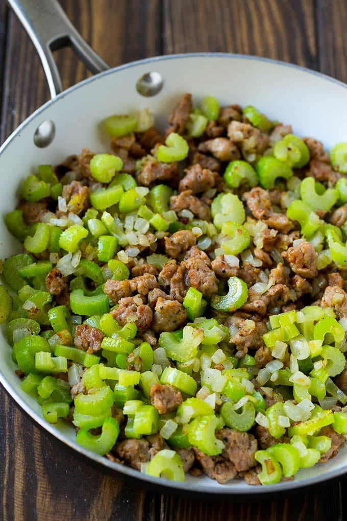 Sausage Stuffing Recipe | Thanksgiving Stuffing | Make Ahead Stuffing #stuffing #thanksgiving #sausage #sidedish #dinner #uzhal A pan of cooked sausage, celery and onions.