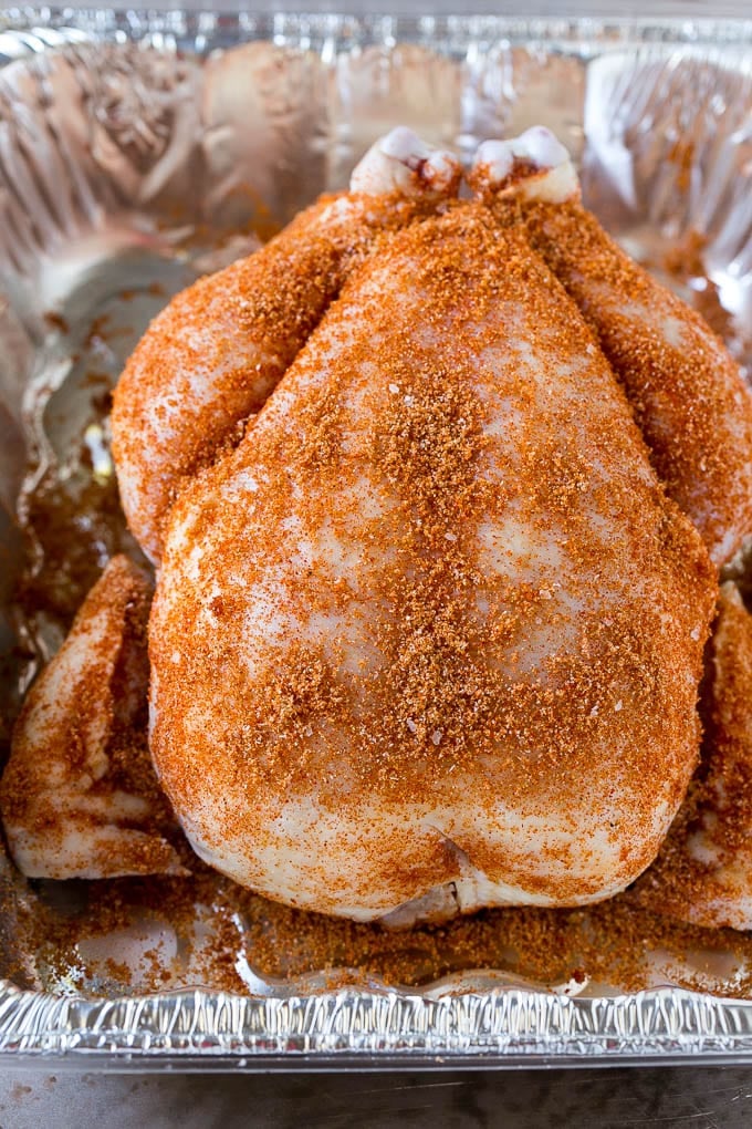 Smoked Chicken Recipe | Whole Smoked Chicken | BBQ Chicken #chicken #smoker #BBQ #dinner #uzhal #glutenfree #lowcarb A raw bird is coated with homemade spice rub in a roasting pan.