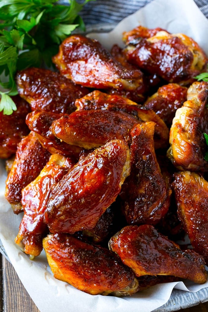 Smoked Chicken Wings | Barbecue Chicken Wings | BBQ Chicken Wings #chicken #wings #bbq #barbecue #appetizer #dinner #uzhal Smoked chicken wings brushed with homemade BBQ sauce on a serving plate.