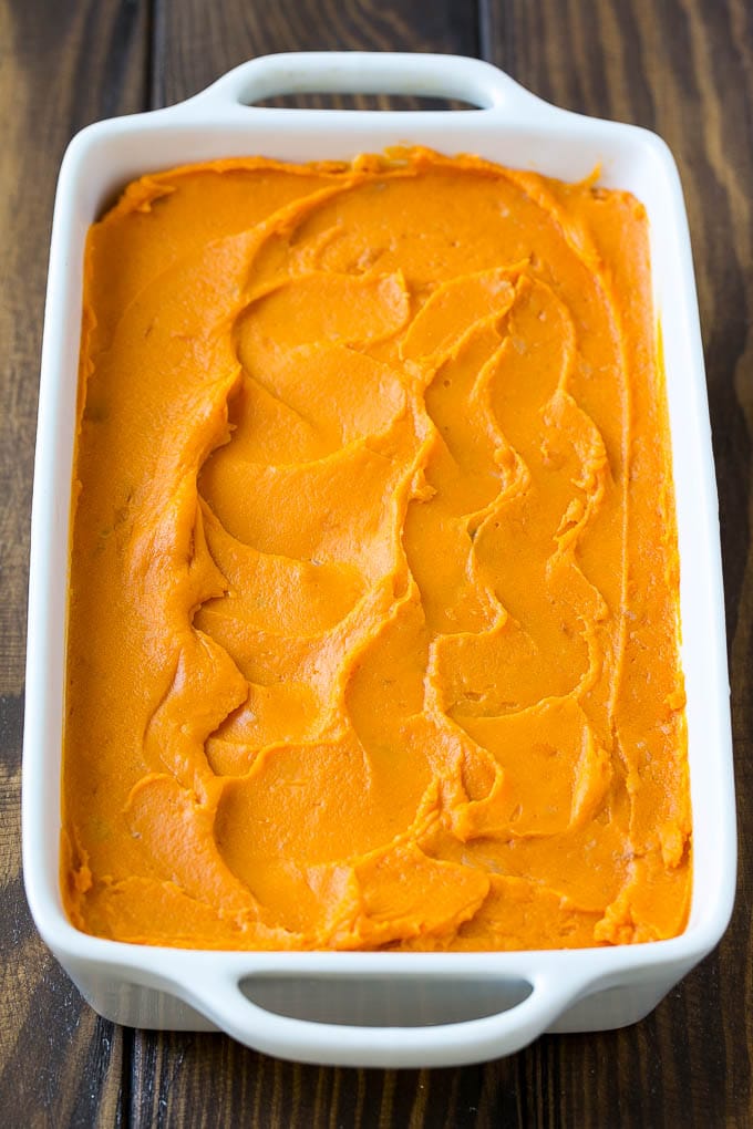 Sweet Potato Casserole with Pecans Recipe | Sweet Potato Casserole | Sweet Potato Side Dish #sweetpotatoes #thanksgiving #pecans #casserole #sidedish #holiday #fall #uzhal Mashed sweet potatoes in a baking dish.