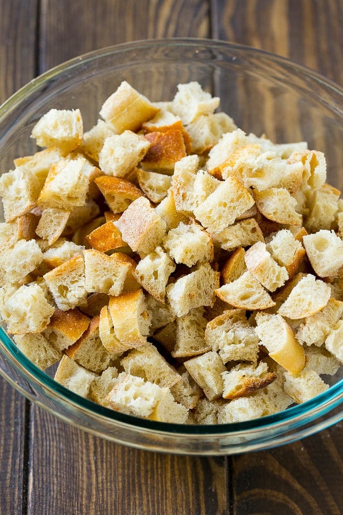 Turkey Stuffing Recipe | Thanksgiving Stuffing | Classic Stuffing #thanksgiving #stuffing #sidedish #fall #uzhal Dried bread cubes in a mixing bowl.