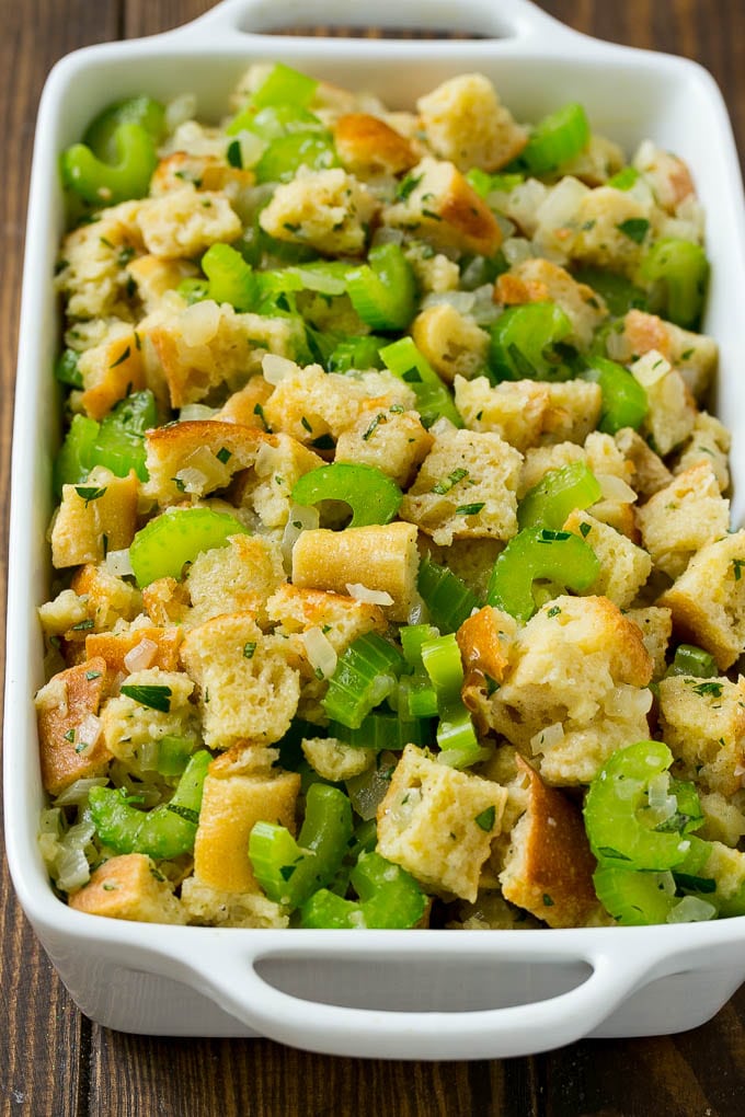Turkey Stuffing Recipe | Thanksgiving Stuffing | Classic Stuffing #thanksgiving #stuffing #sidedish #fall #uzhal Uncooked holiday stuffing in a baking dish.